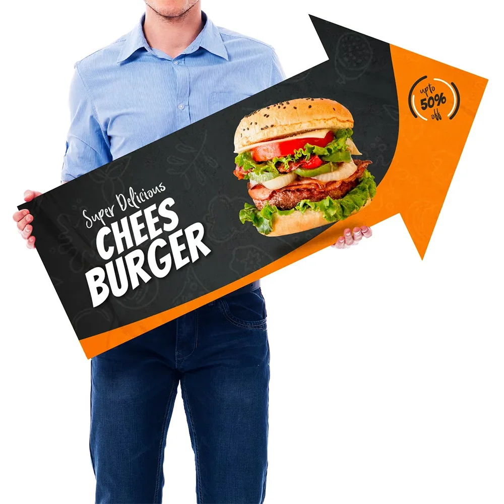 Person holding a large arrow-shaped custom banner for a cheeseburger promotion.