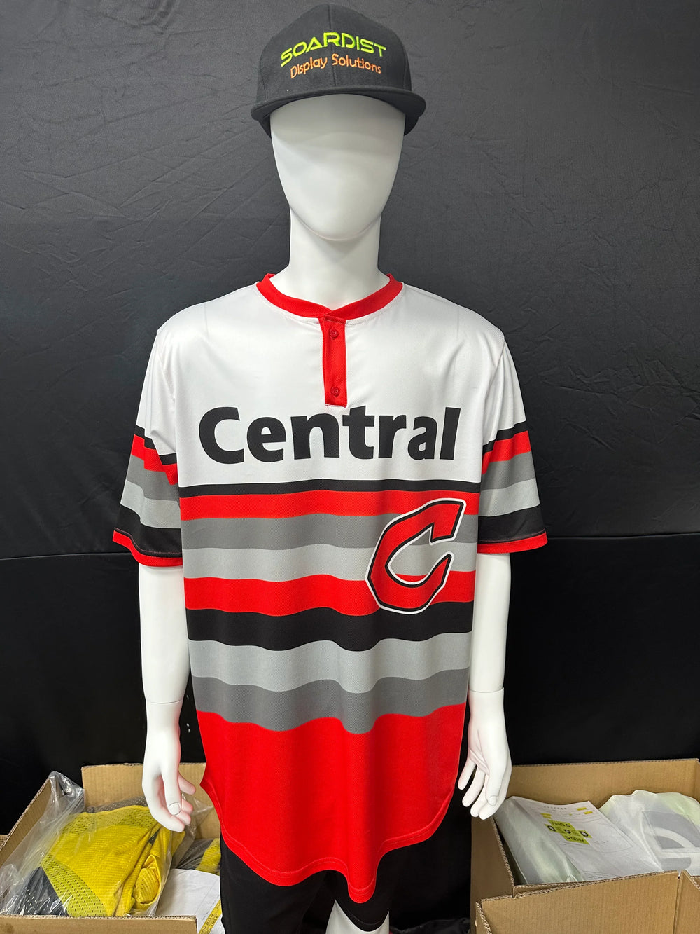 Custom white, red, and grey striped polo shirt with 'Central' text on a mannequin