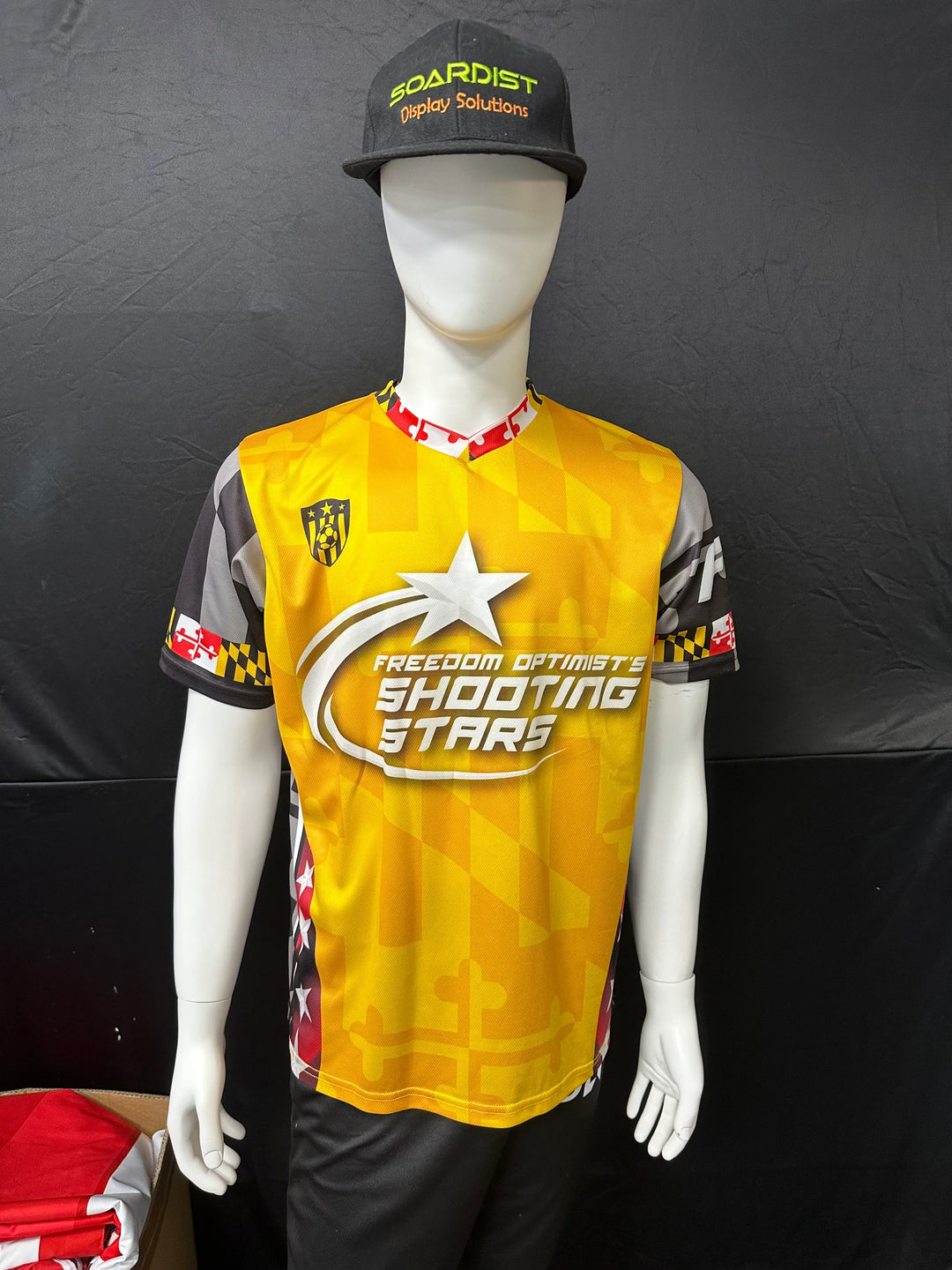 Custom yellow and black athletic jersey with Shooting Stars graphics on a mannequin