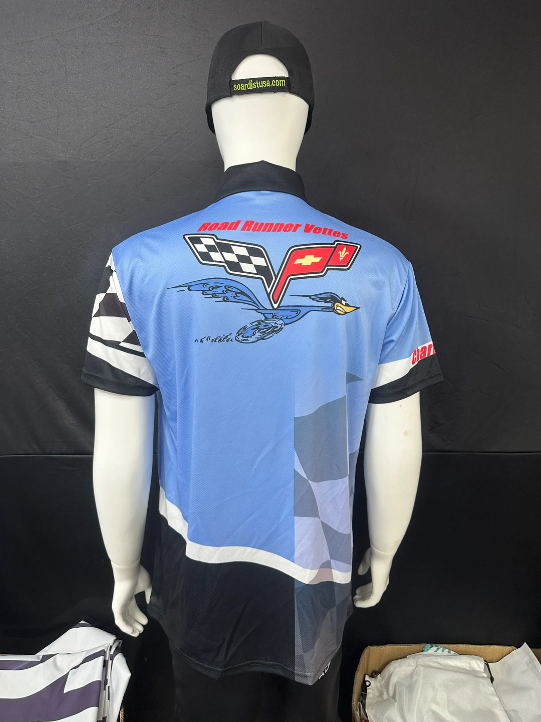 Back view of a light blue custom Road Runner Vettes racing shirt on a mannequin.