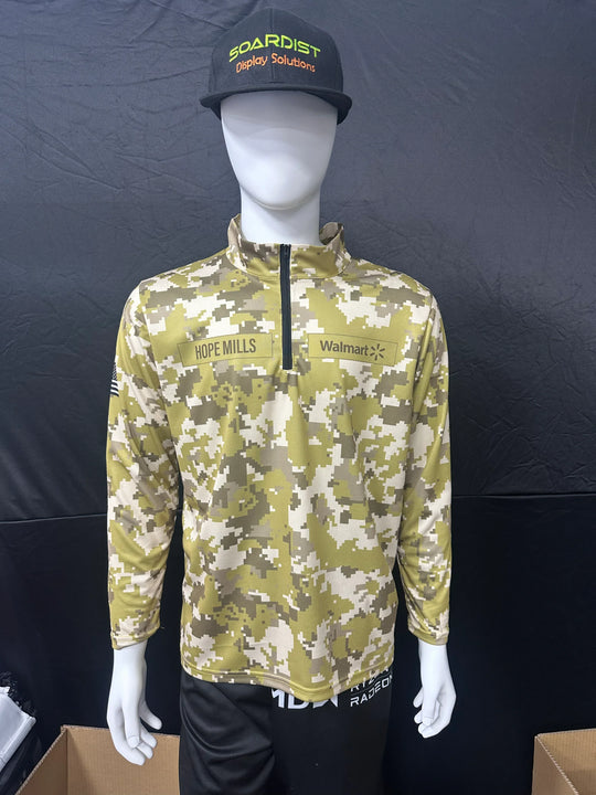 Mannequin wearing a custom digital camouflage quarter-zip pullover with company logos.