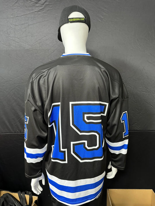 Back view of a black custom hockey jersey with blue and white number 15