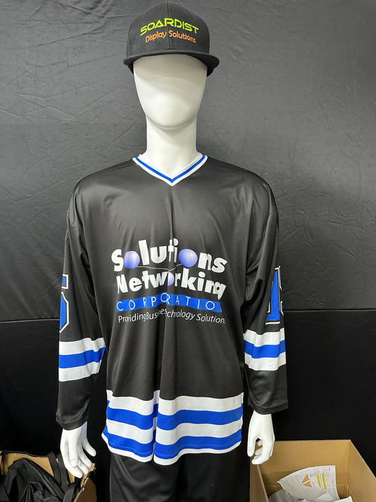 Mannequin wearing a custom black and blue hockey jersey with company branding