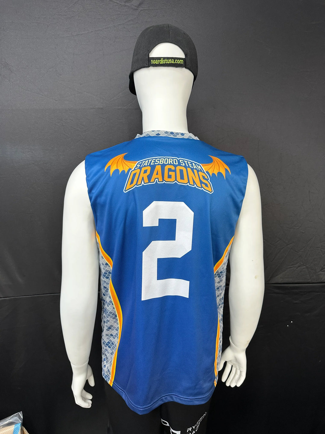 Back view of a blue Statesboro Steam Dragons custom jersey with number 2 on a mannequin