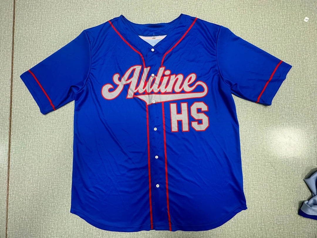 Blue custom Aldine HS baseball jersey with red piping and white lettering