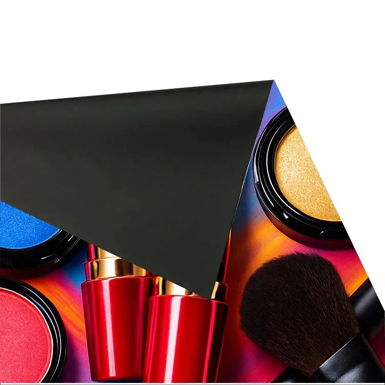 Close-up of colorful makeup products including eyeshadow, lipstick, and a makeup brush.