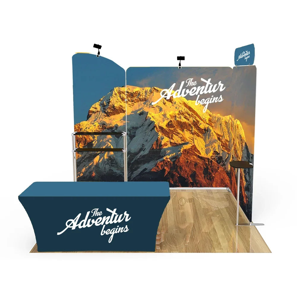 Custom trade show display with mountain graphic backdrop, table cover, and bar stool.