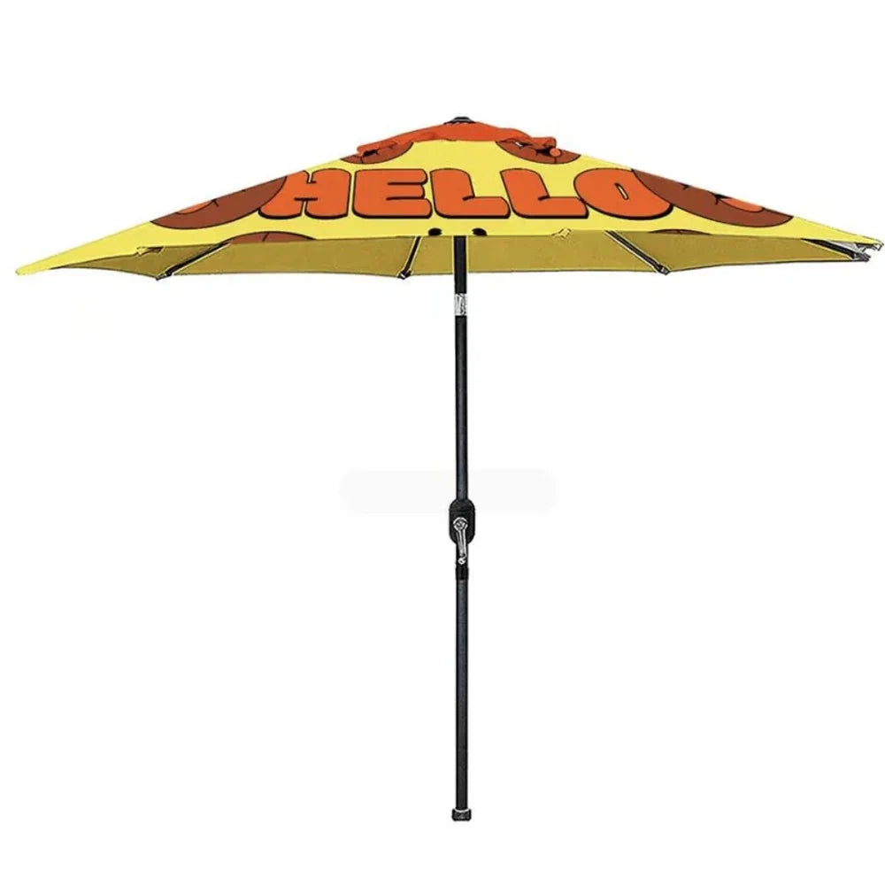 Custom yellow patio umbrella with orange 'HELLO' text printed on the canopy