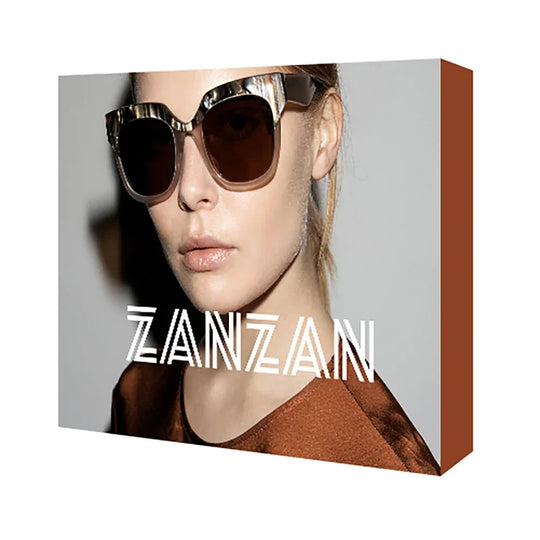 Woman wearing oversized square sunglasses with ZANZAN text overlay on a canvas print.