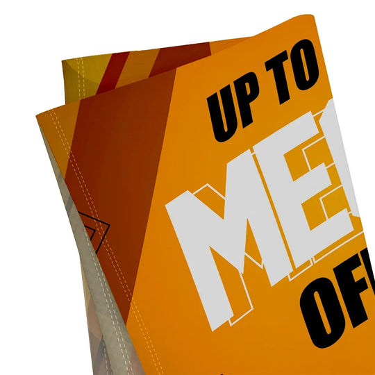 Close-up of a custom printed orange promotional brochure with bold white and black text.
