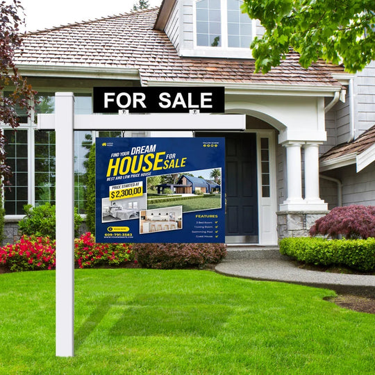 Custom real estate for sale sign displayed in front of a residential house and lawn