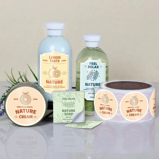 Custom branded product labels on cream jars, soap boxes, and bottles.
