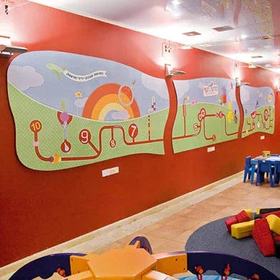 Colorful custom wall mural for a children's playroom with educational numbers and a rainbow.