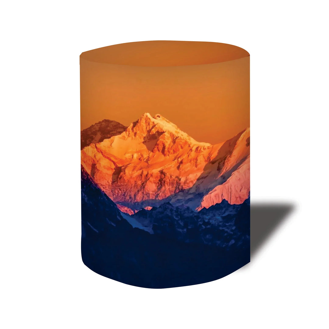 Custom printed cylindrical fabric display with a sunset mountain landscape graphic