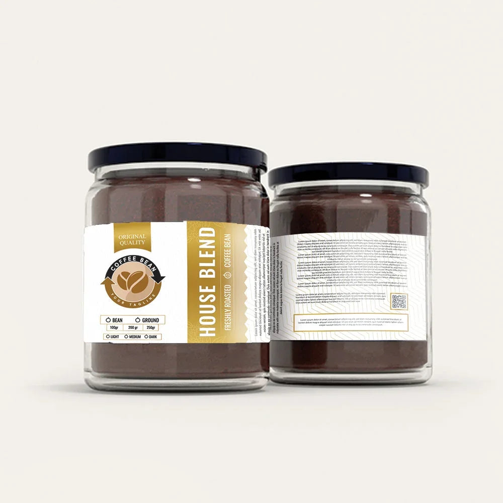 Two glass jars of House Blend coffee with white and gold labels.