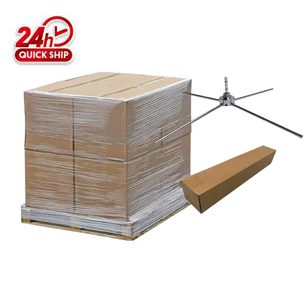 Stacked shipping boxes on a pallet next to a metal tent frame and long cardboard tube