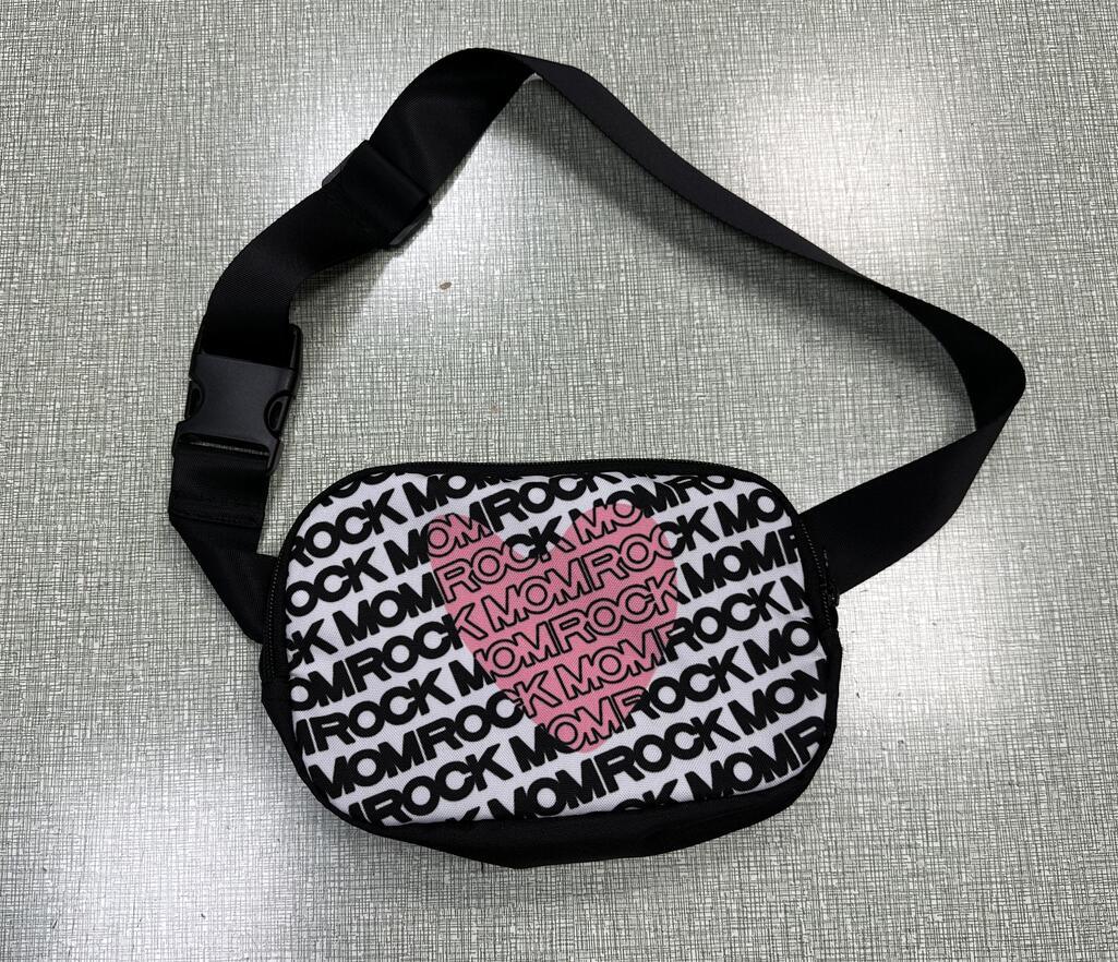 Black fanny pack with white 'ROCK MOM' repeating text pattern and a pink heart