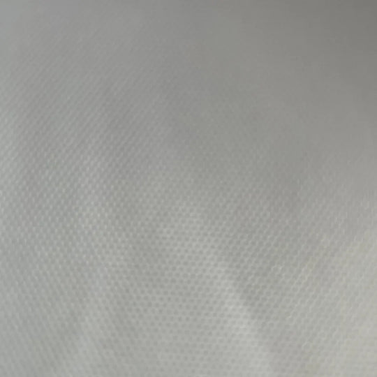 Close-up texture of white polyester fabric used for custom tents and banners