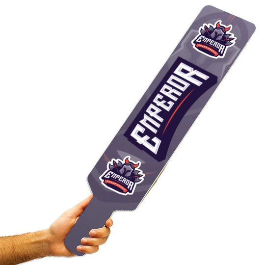 A person holding a custom purple sports fan paddle with Emperador Championship branding.