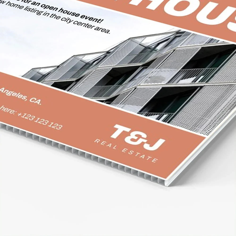 Custom real estate corrugated plastic banner featuring a modern building image and T&J logo.