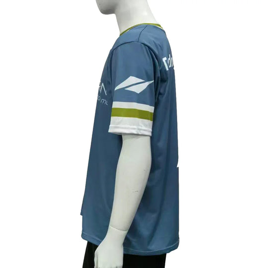 Side view of a custom blue short-sleeve sports jersey with white and green accents.