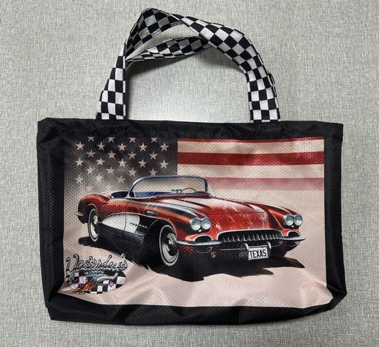 Black tote bag featuring a red classic Corvette with a US flag background and Texas plate.