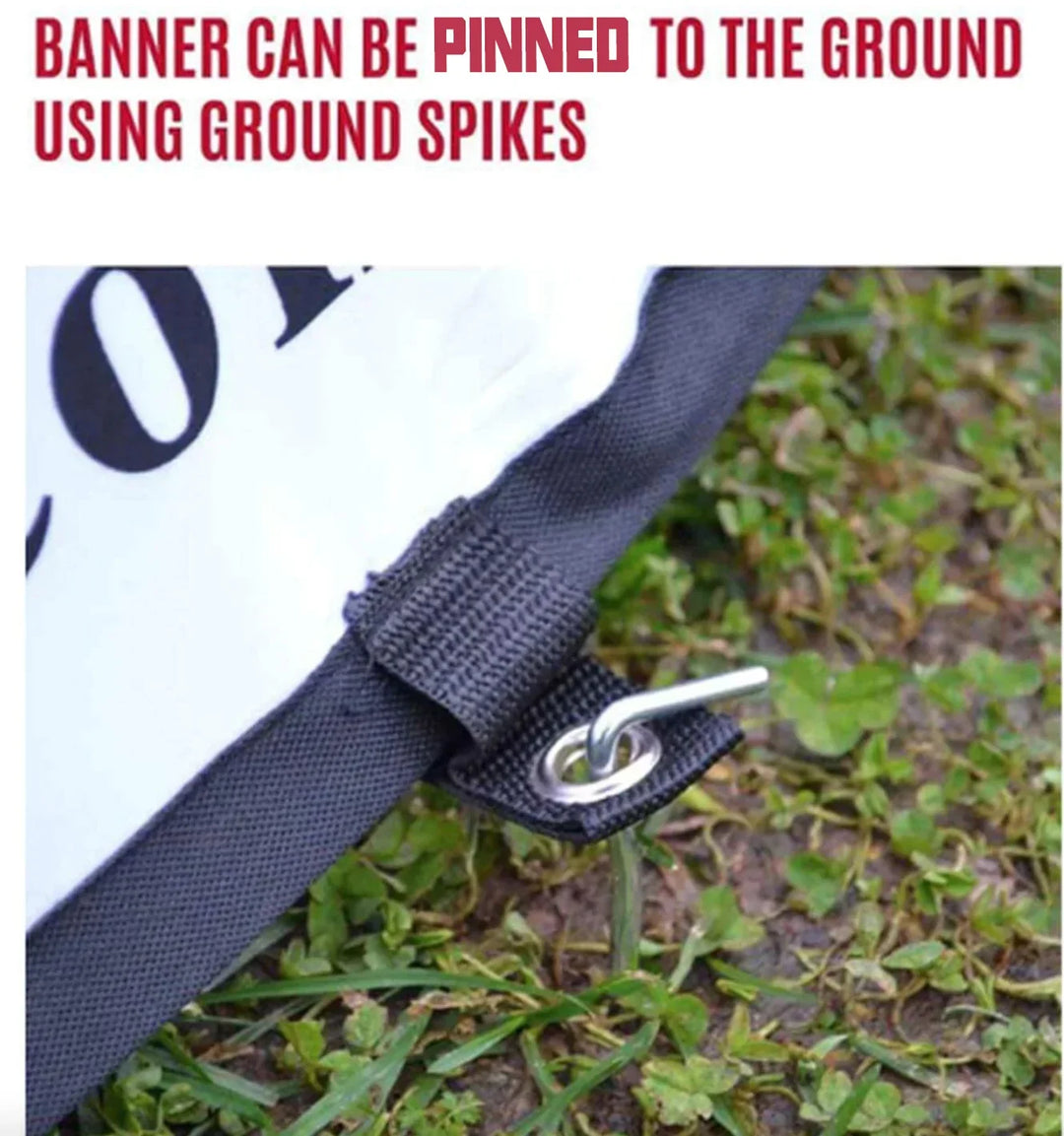 Custom banner corner pinned to the ground with a metal ground spike