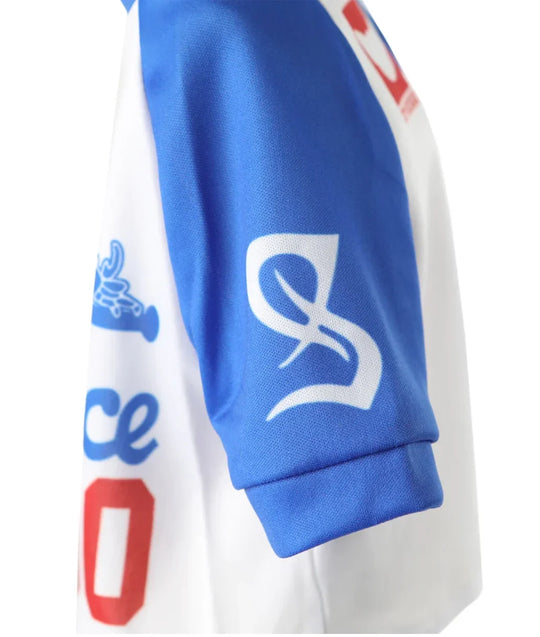 Close-up of a blue and white custom athletic jersey sleeve with a white stylized logo.