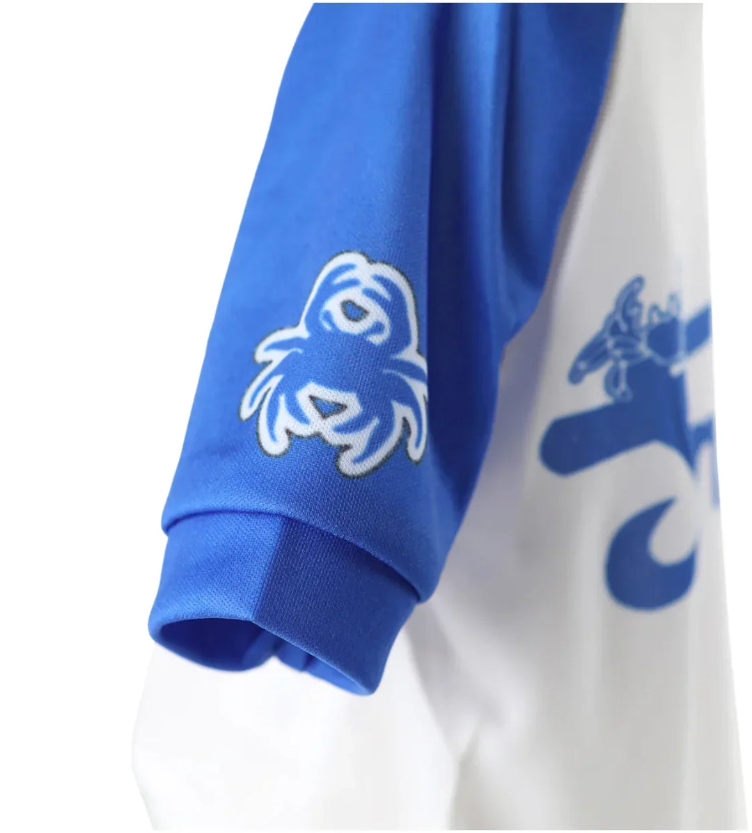 Close-up of a blue and white custom apparel sleeve with a white graphic logo.